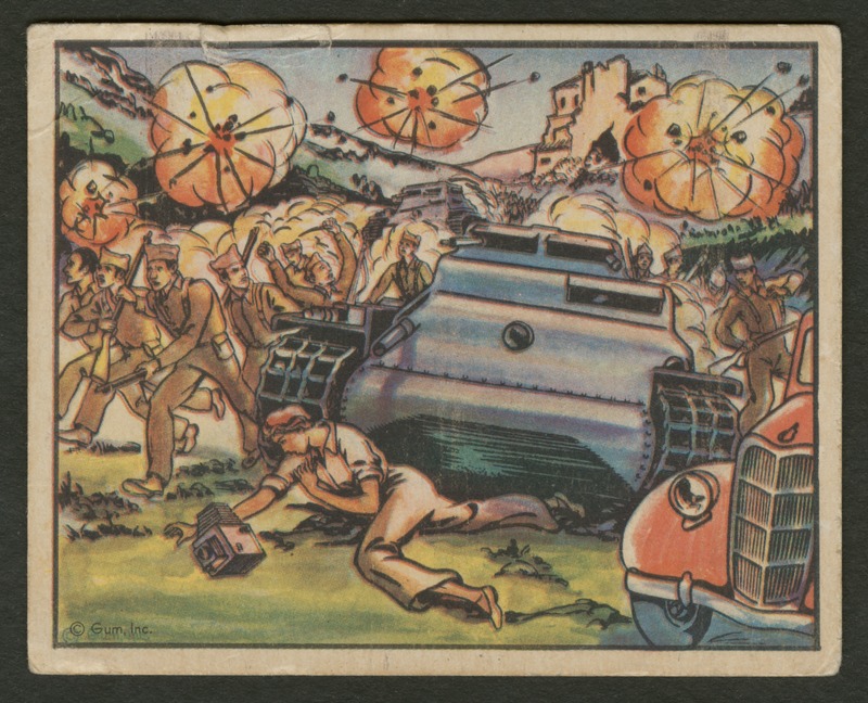 Front of postcard (recto). Image of a cartoon woman with a camera being run over by a tank. Along the sides of the tank, lines of soldiers in yellow-brown uniforms run. In the background, the lines of soldiers continues. There is a large building on top of a hill. There are several explosions in the air. Another tank follows the lines of soldiers in the background. In the foreground, there is part of a red car. 